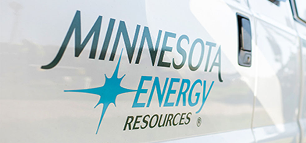 A Minnesota Energy Resources logo installed on the side of a white truck.